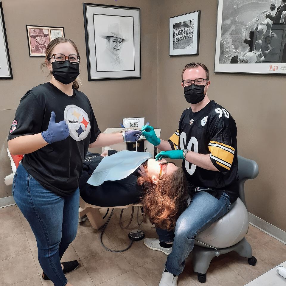 Team members providing same-day orthodontic consultation and treatment to patient