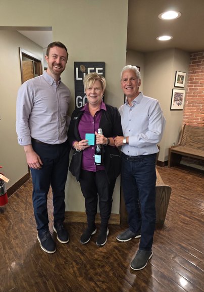 Doyle Orthodontics doctors celebrating a team member in the office